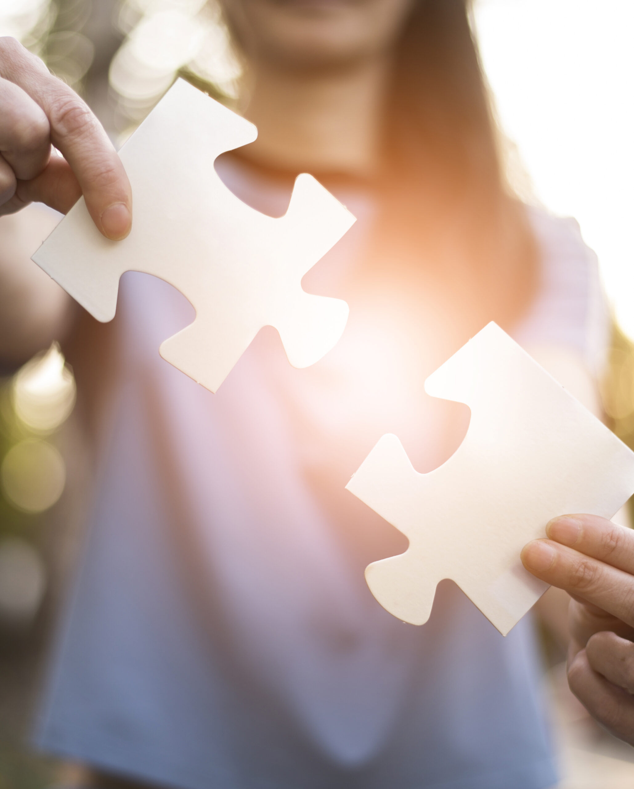 front-view-of-woman-holding-puzzle-pieces